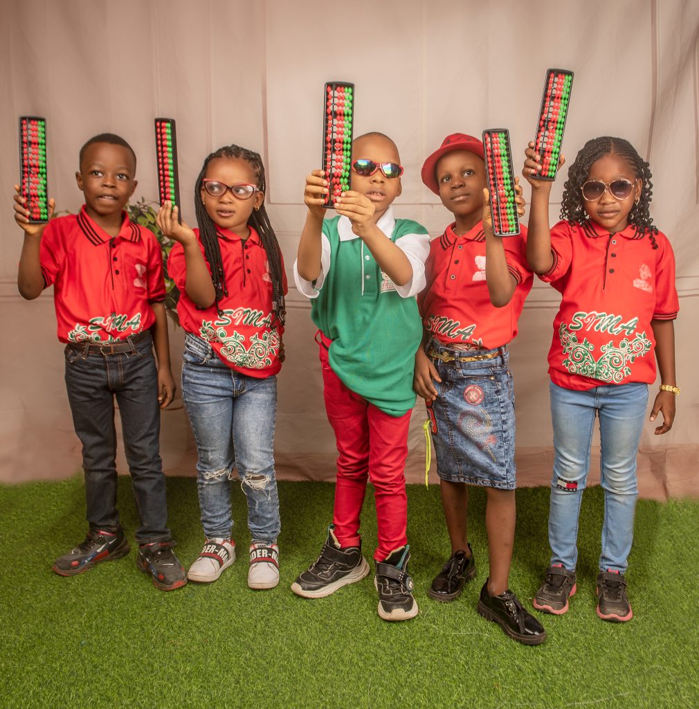 SIMA Abacus kids holding their abacus