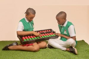 SIMA Abacus students with a Big Abacus