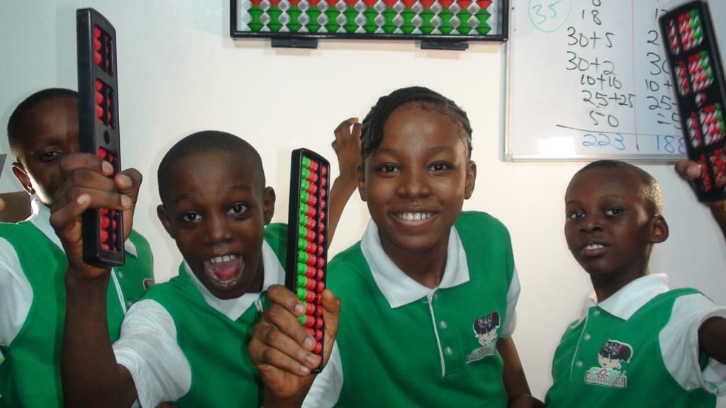Children practicing abacus training in Nigeria with SIMA Abacus during term break