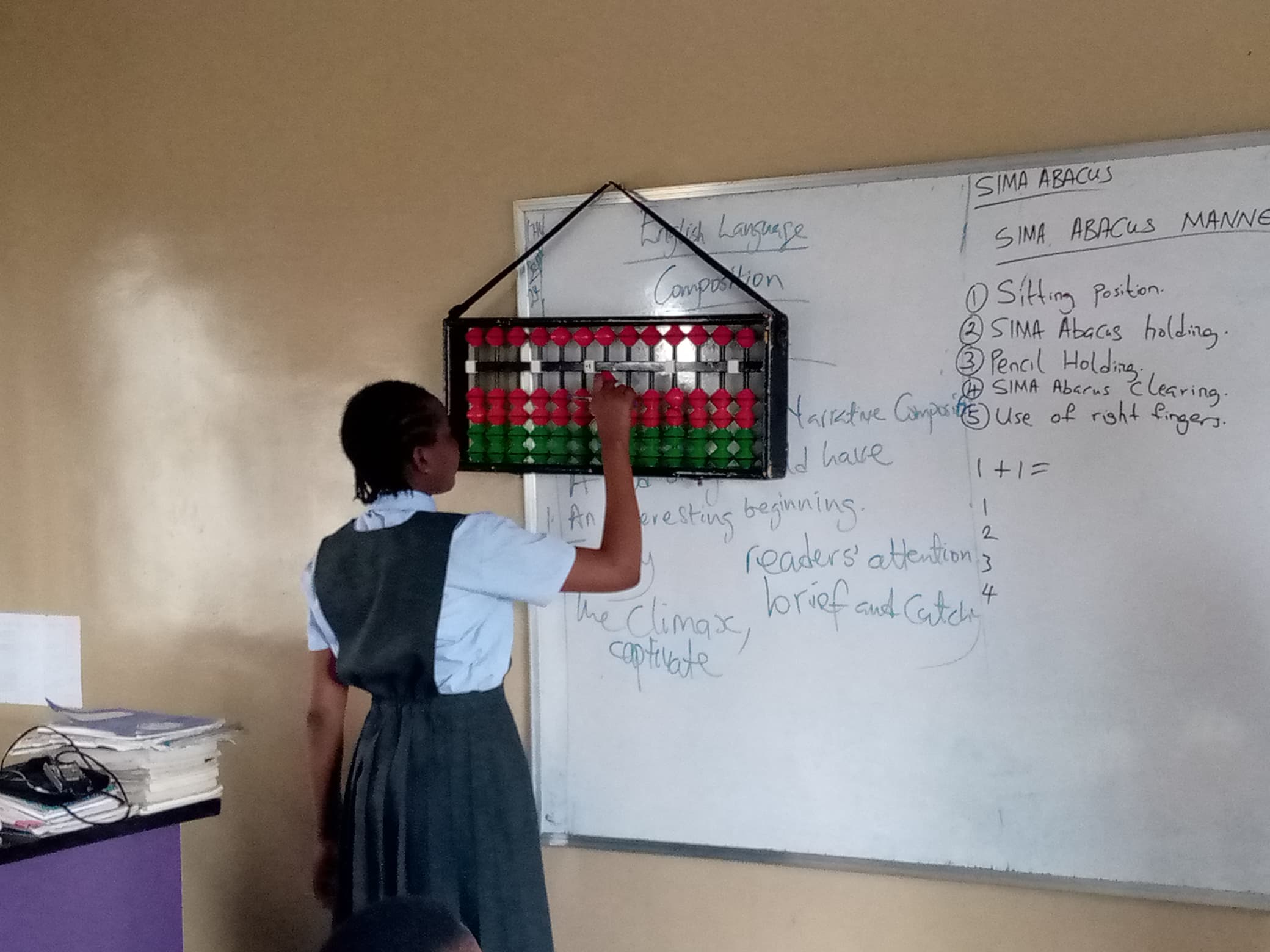 Students using abacus in a Nigerian classroom